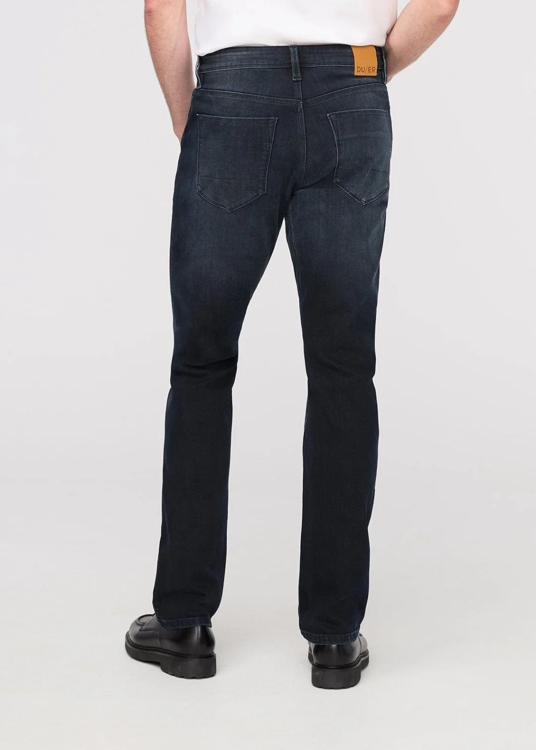 Man wearing dark blue DUER jeans