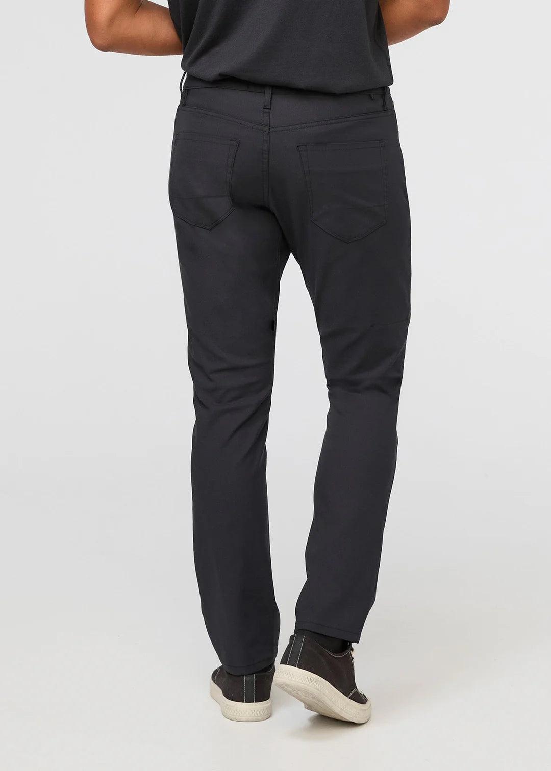 Back view of DUER's NuStretch Relaxed 5-Pocket Pant in the color Black