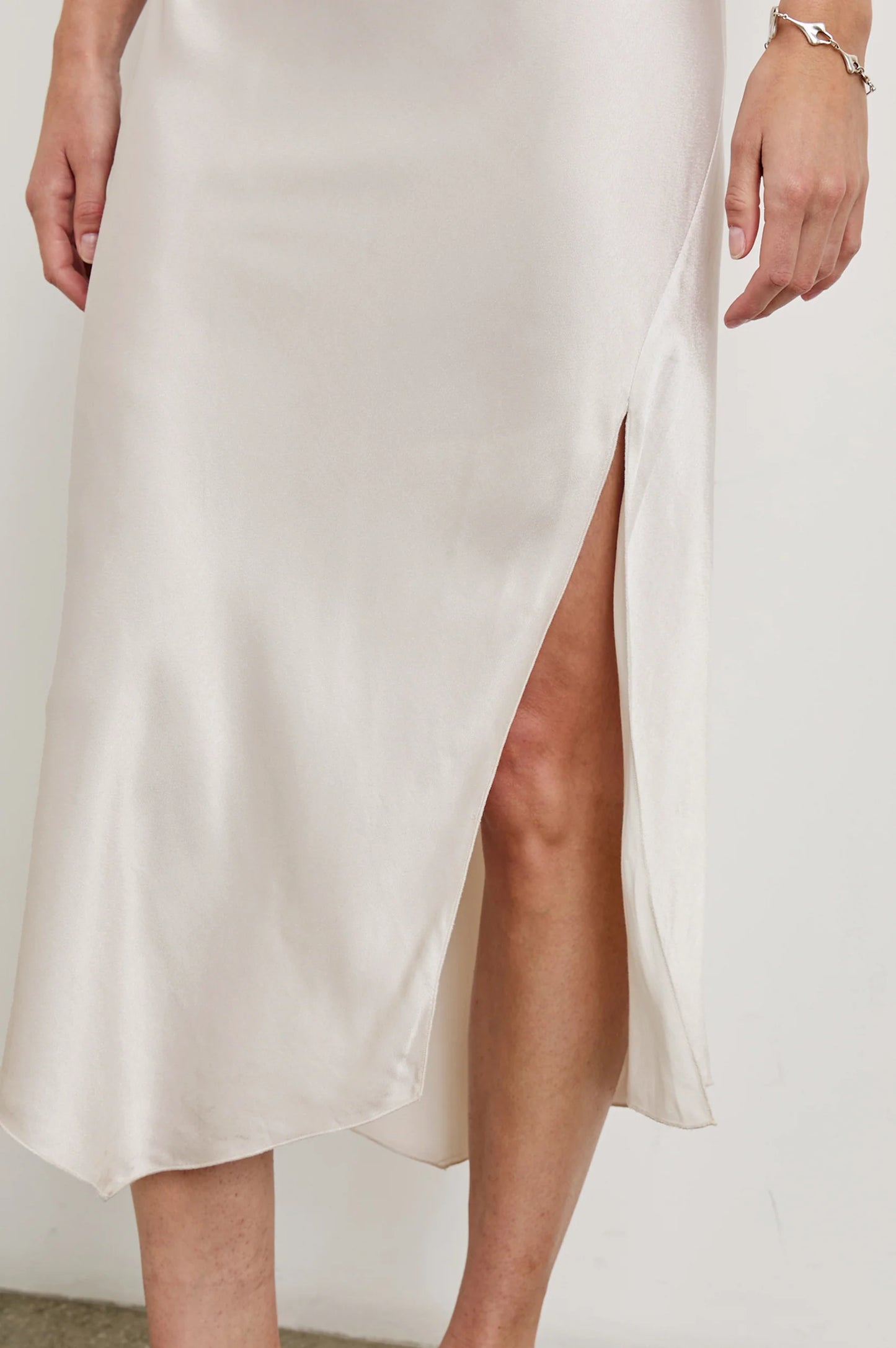 Side slit detail on the Ivory Monique Midi Slip Dress by Rails