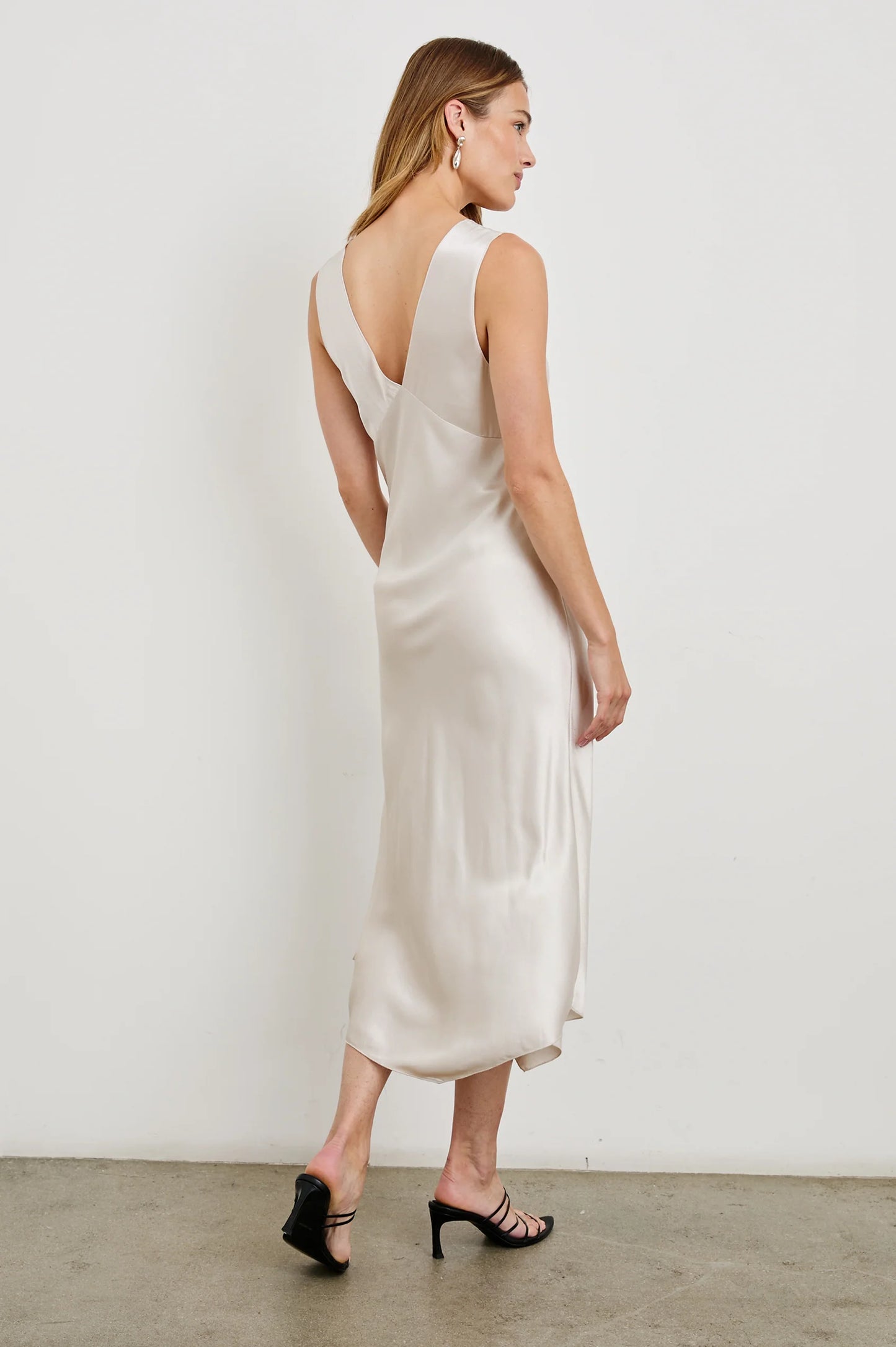 Back view of a woman wearing the Ivory Monique Midi Slip Dress by Rails