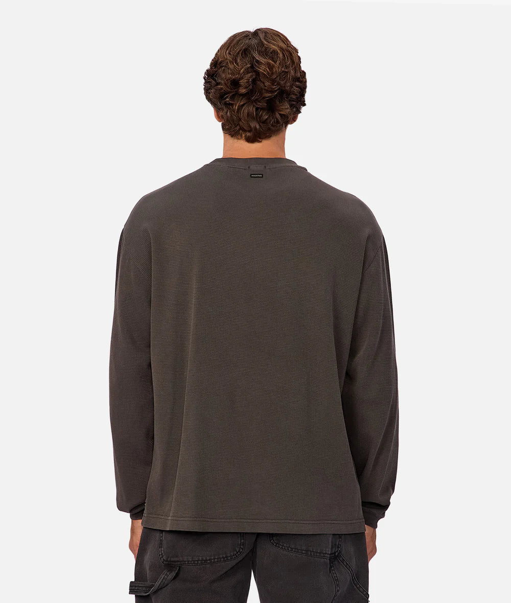 A man wearing a dark grey long sleeve shirt from Industrie
