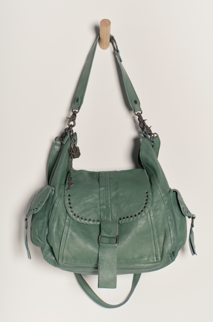 Enjoy multiple ways to wear this hobo-style leather tote bag from Free People. Shop yours at Harbour Thread boutique in Burlington, VT!