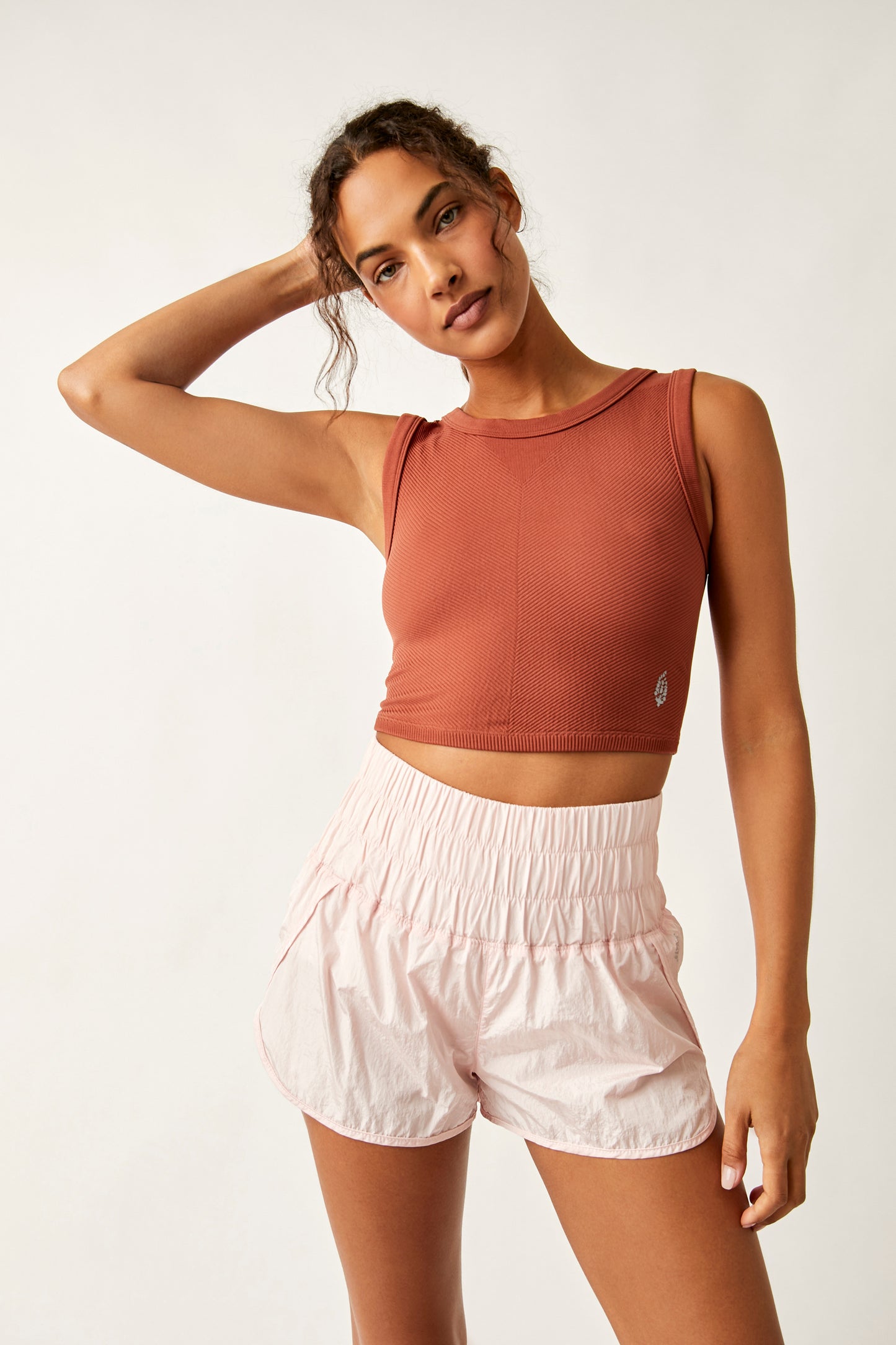 Front view of the Free People Free Throw Muscle Tank in the color Sequoia