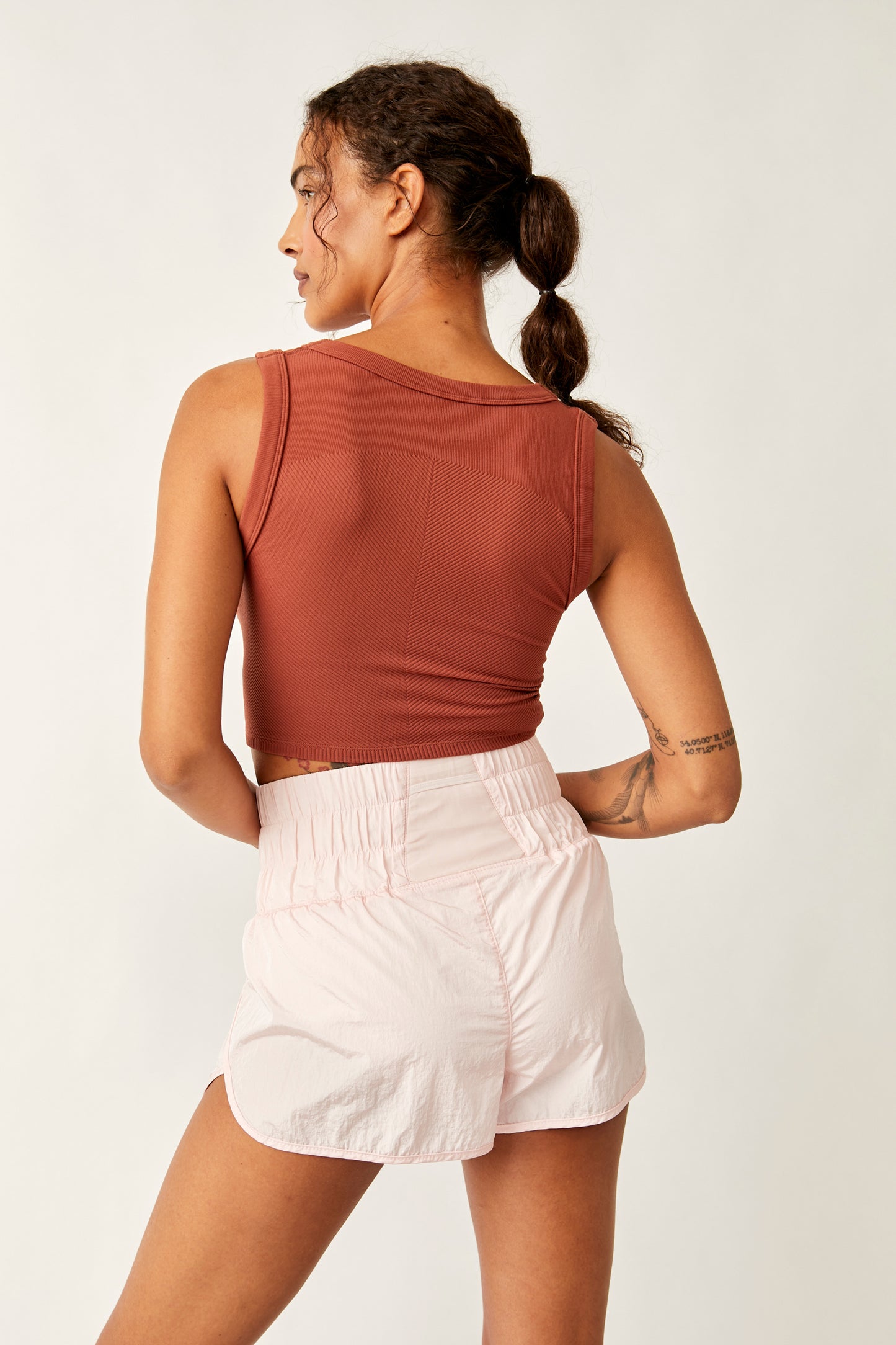 Back view of the Free People Free Throw Muscle Tank in the color Sequoia