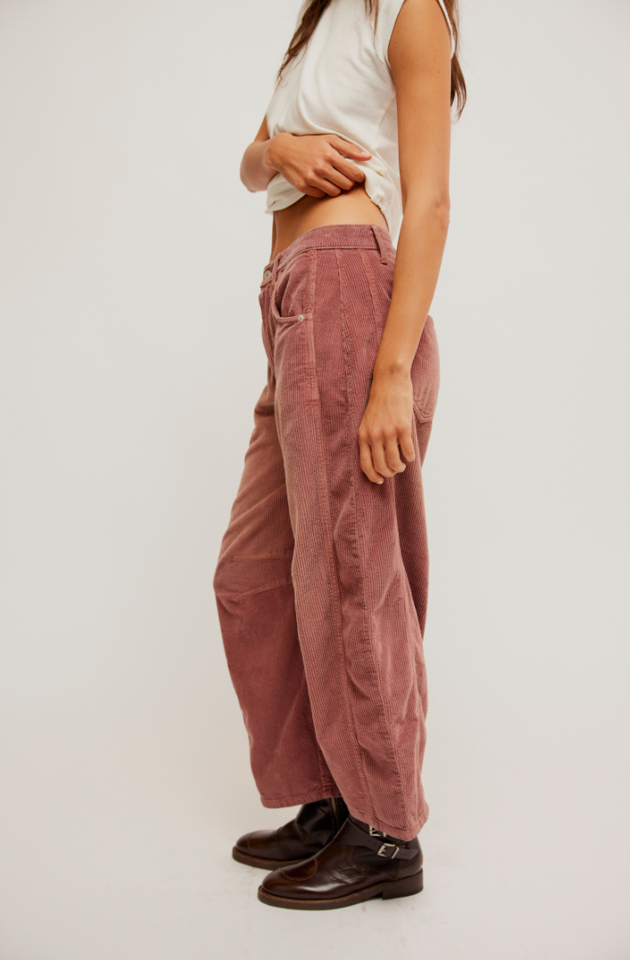 The Withered Rose Mid-Rise Cord Barrel Jeans by Free People offer a relaxed fit with an on-trend silhouette
