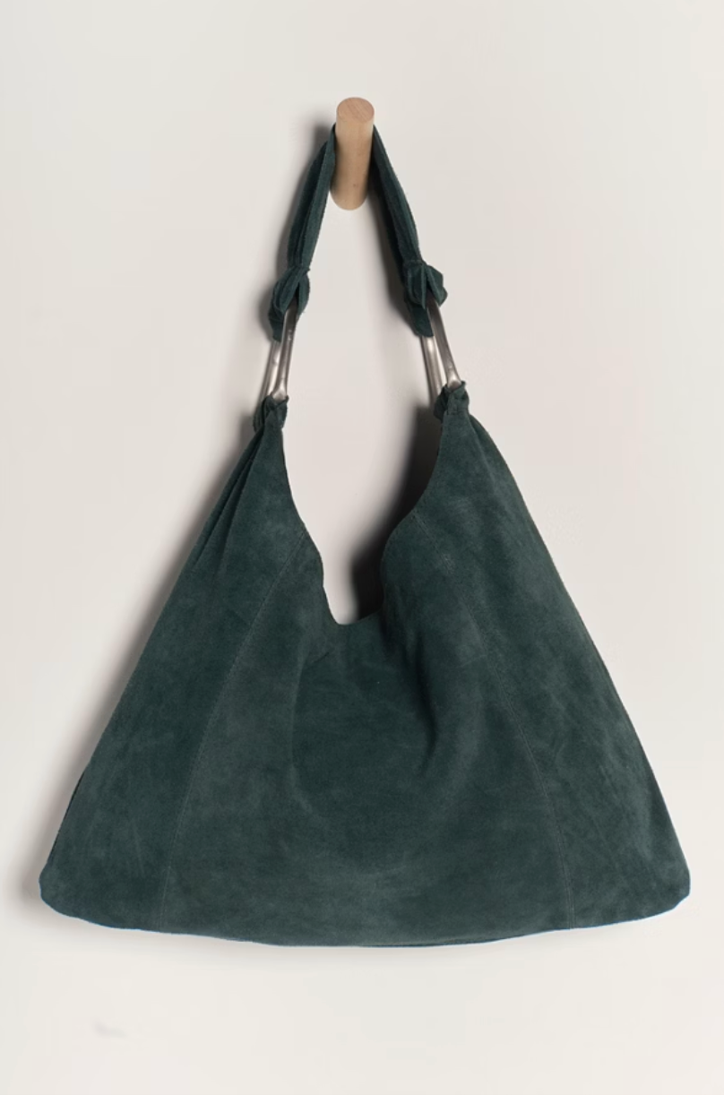 This timeless tote bag from Free People is an easy everyday accessory with a slouchy, suede silhouette you'll love. Find it at Harbour Thread in Burlington, VT!