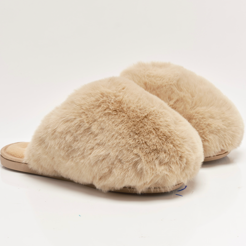 The Free People Snowball Slippers are available in Taupe Faux Fur at Harbour Thread boutique.