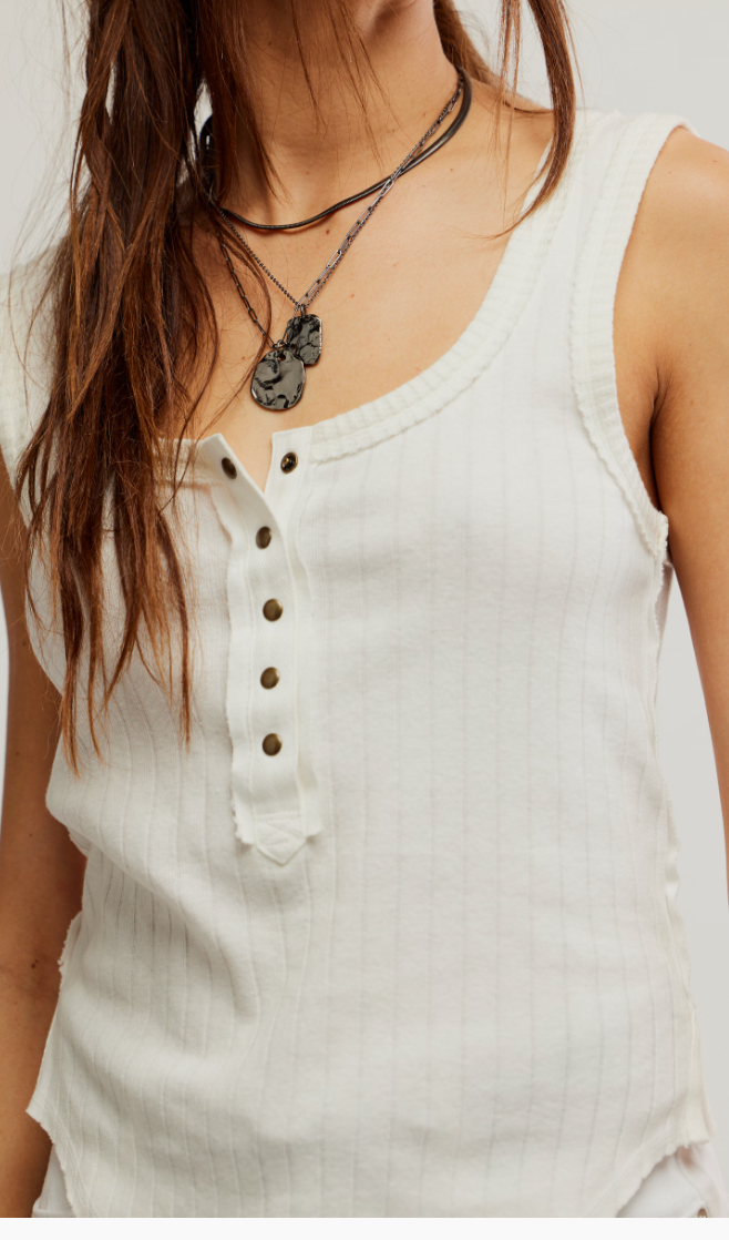 The Free People Bryson Henley Tank offers a wide rib texture with henley snap detail