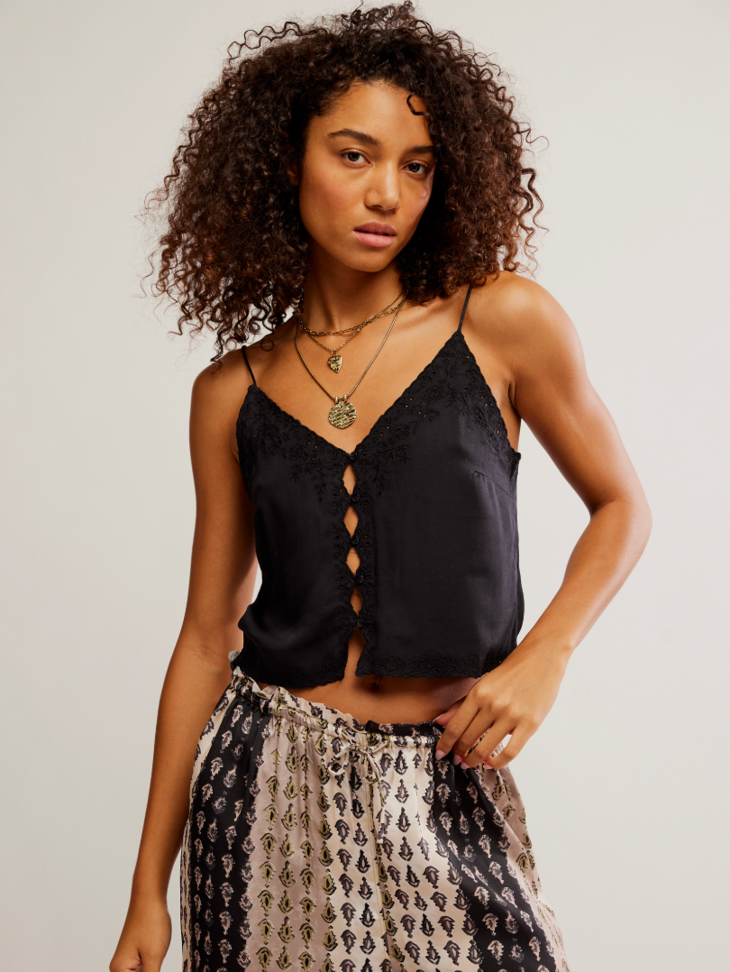 A woman wearing the Free People Pieces Of You Cami in Black