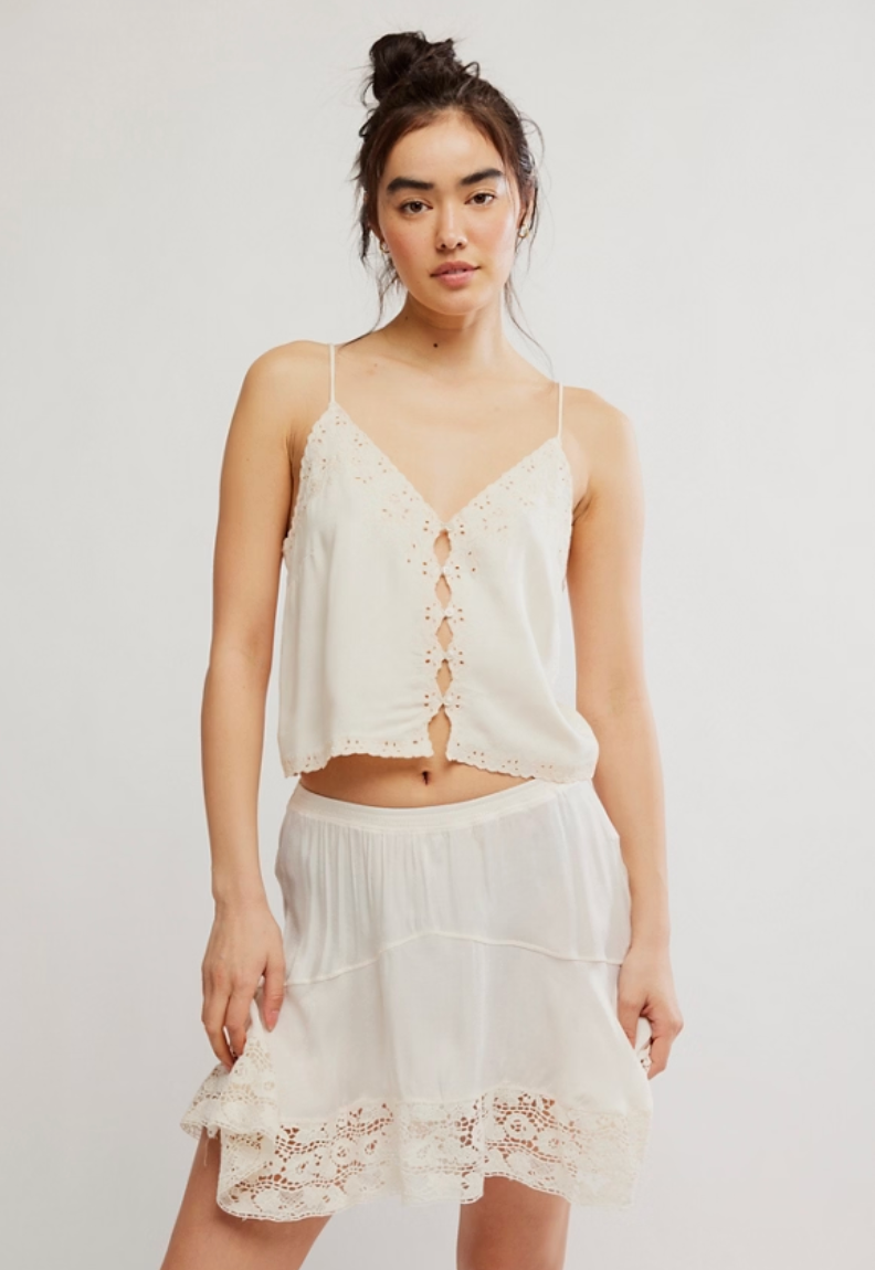 The Free People Pieces Of You Cami pairs a flowy design with feminine embroidery detail. Find yours at Harbour Thread boutique in Burlington, VT!