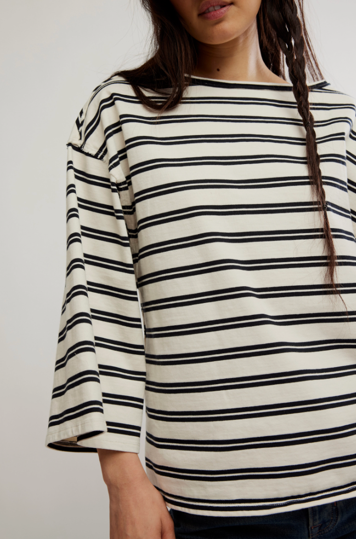 The Free People C'est La Vie Tee at Harbour Thread features a boat neckline and wide 3/4 sleeves for an effortlessly cool look.