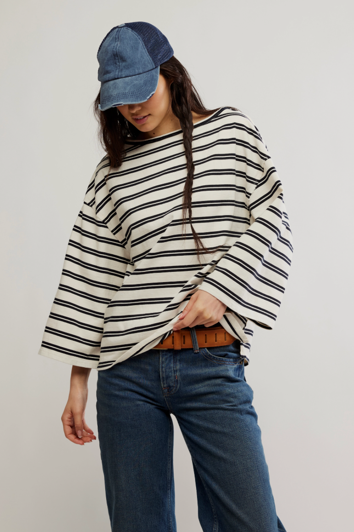 Enjoy a chic statement silhouette with the Free People C'est La Vie Tee, now at Harbour Thread women's boutique in Burlington, VT.