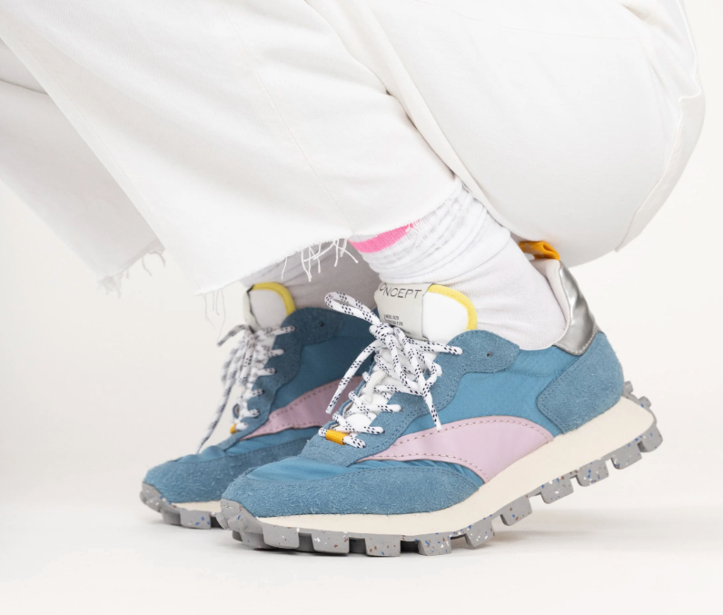 A person wearing the Glacier Blue Osaka lug bottom trainer sneaker by Oncept