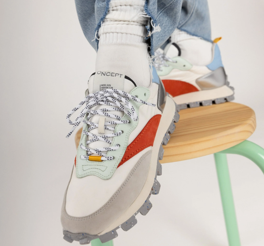 A person wearing the Solar Multi Osaka lug bottom trainer sneaker by Oncept