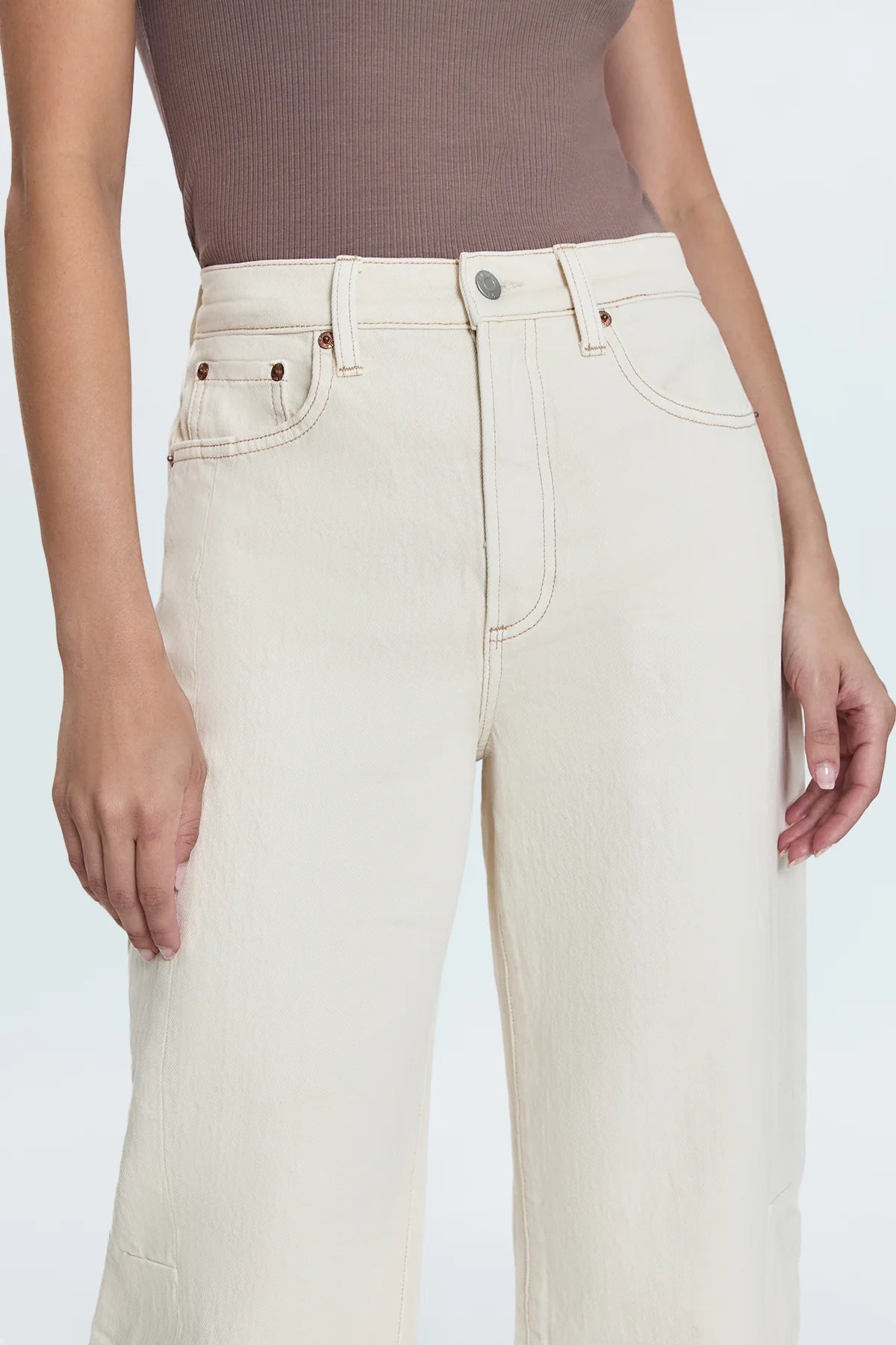 Women's off-white jeans crafted from comfort stretch denim for comfortable movement.