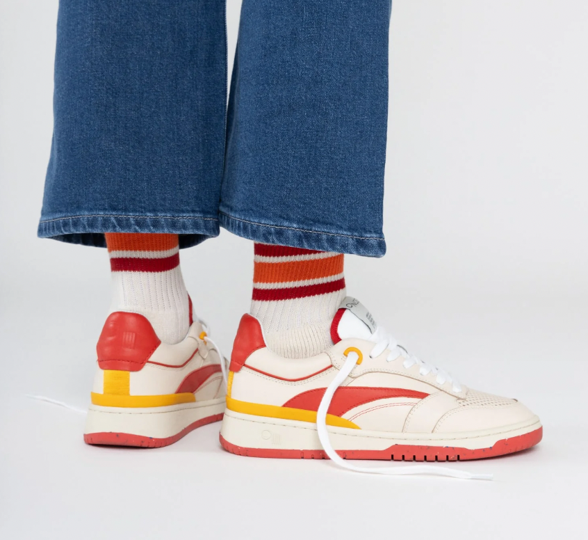 A person wearing the Retro Red Preston Sneaker by Oncept