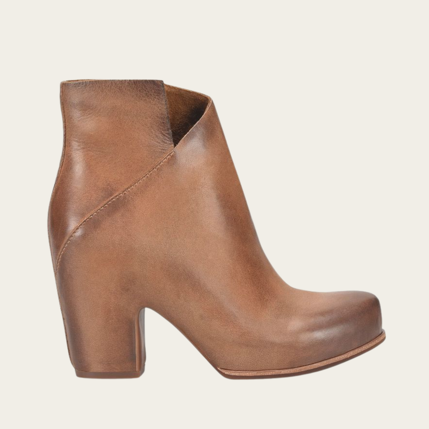The brown leather Seeley hidden platform bootie by Kork-Ease features a unique cross-front silhouette