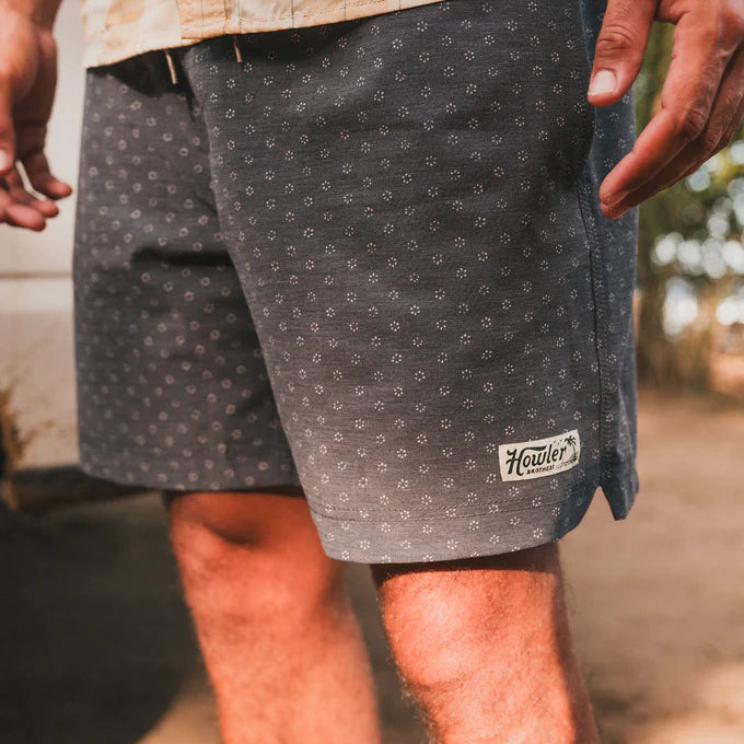 Man wearing the 17" Deep Set Boardshorts by Howler Brothers