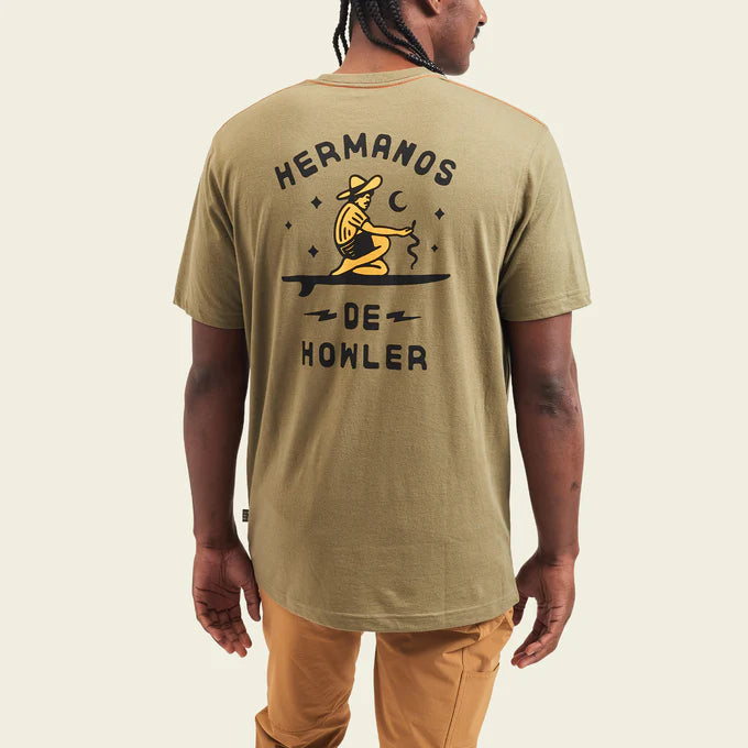 Back view of man wearing the green Ocean Offerings Men's T-shirt by Howler Bros