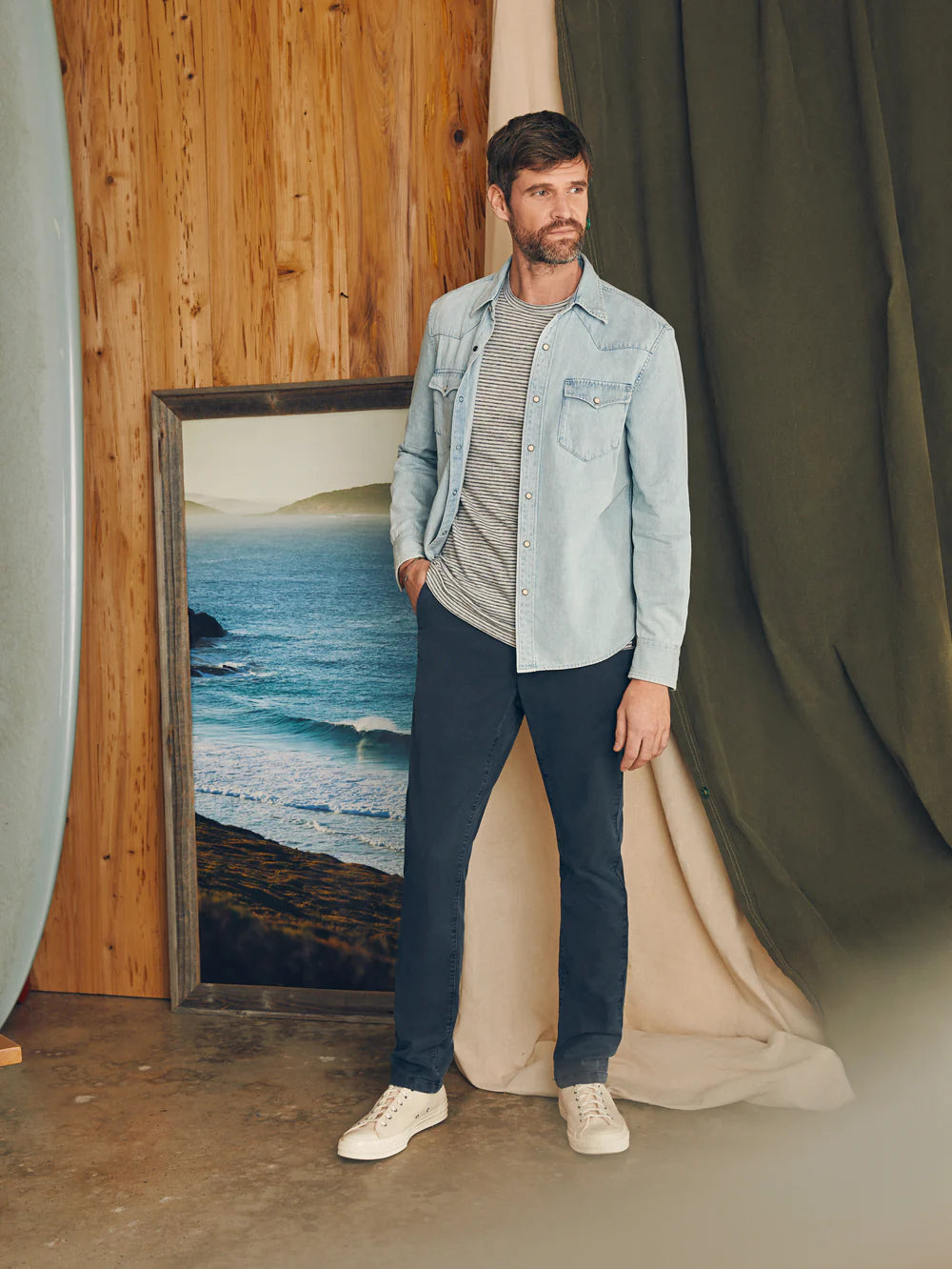 Man wearing Faherty's Coastline Chino Pants in the color Blue Nights