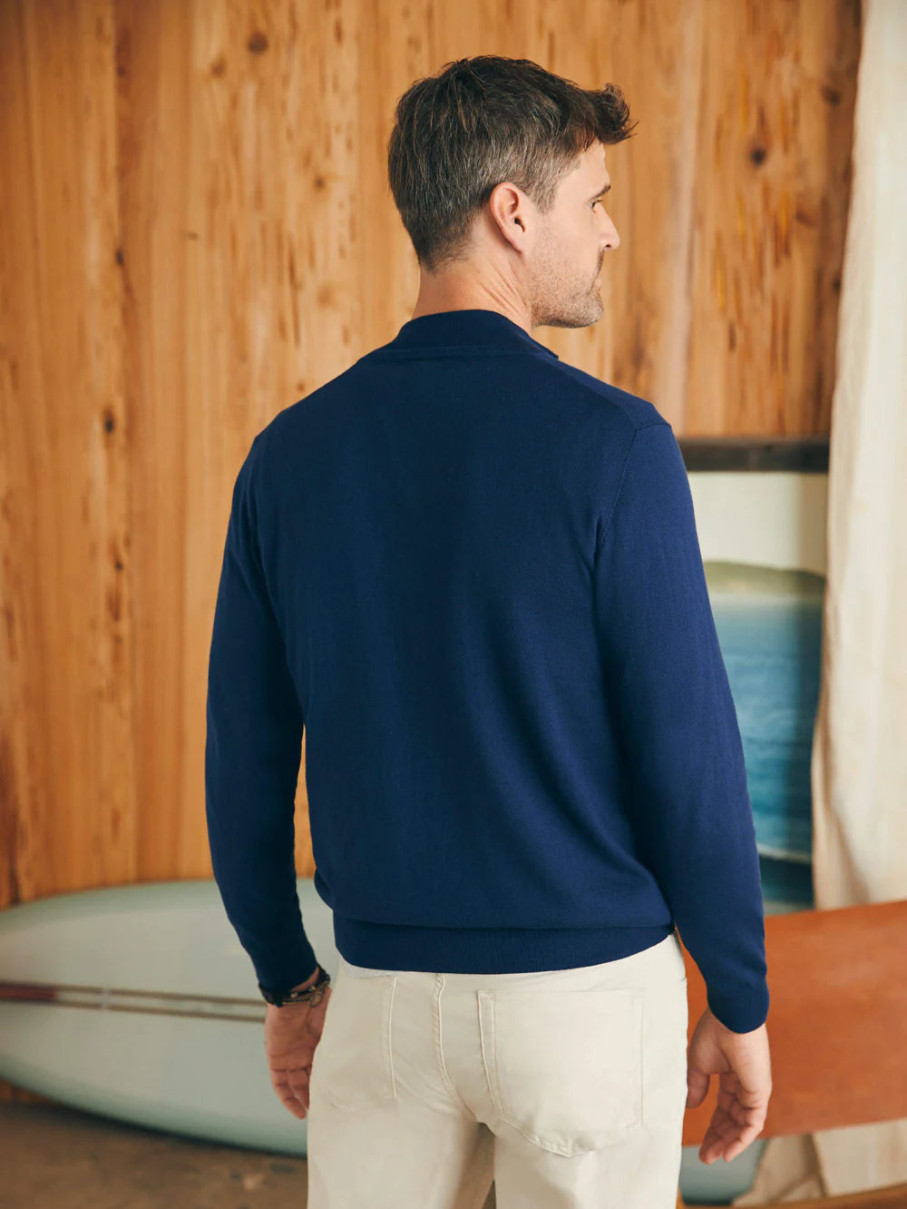 Back view of Faherty's Men's Movement Quarter Zip in the color Marine Navy Heather
