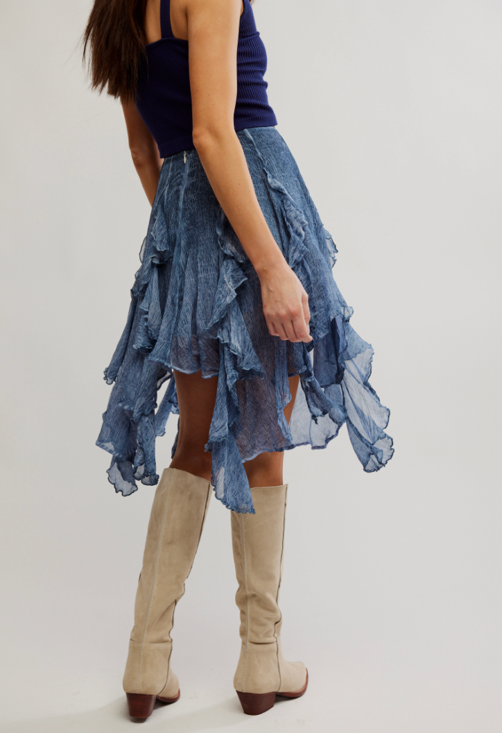 The Free People Susanna Knee-Length Midi Skirt offers a washed dye fabrication and pieced ruffle detail.