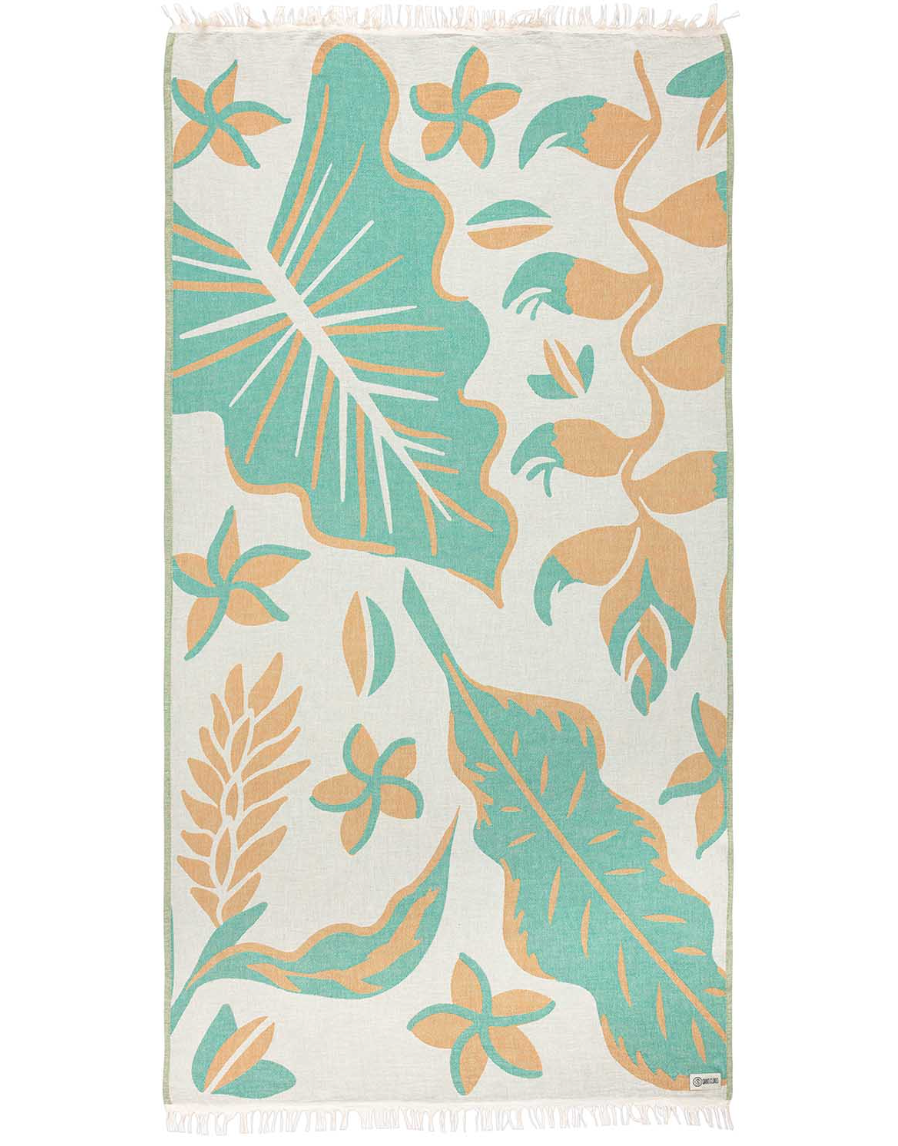 Towel with tropical leaf and flower pattern on a white background