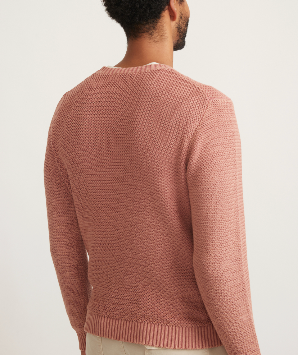 Back view of man wearing a clay color garment dye crew sweater from Marine Layer