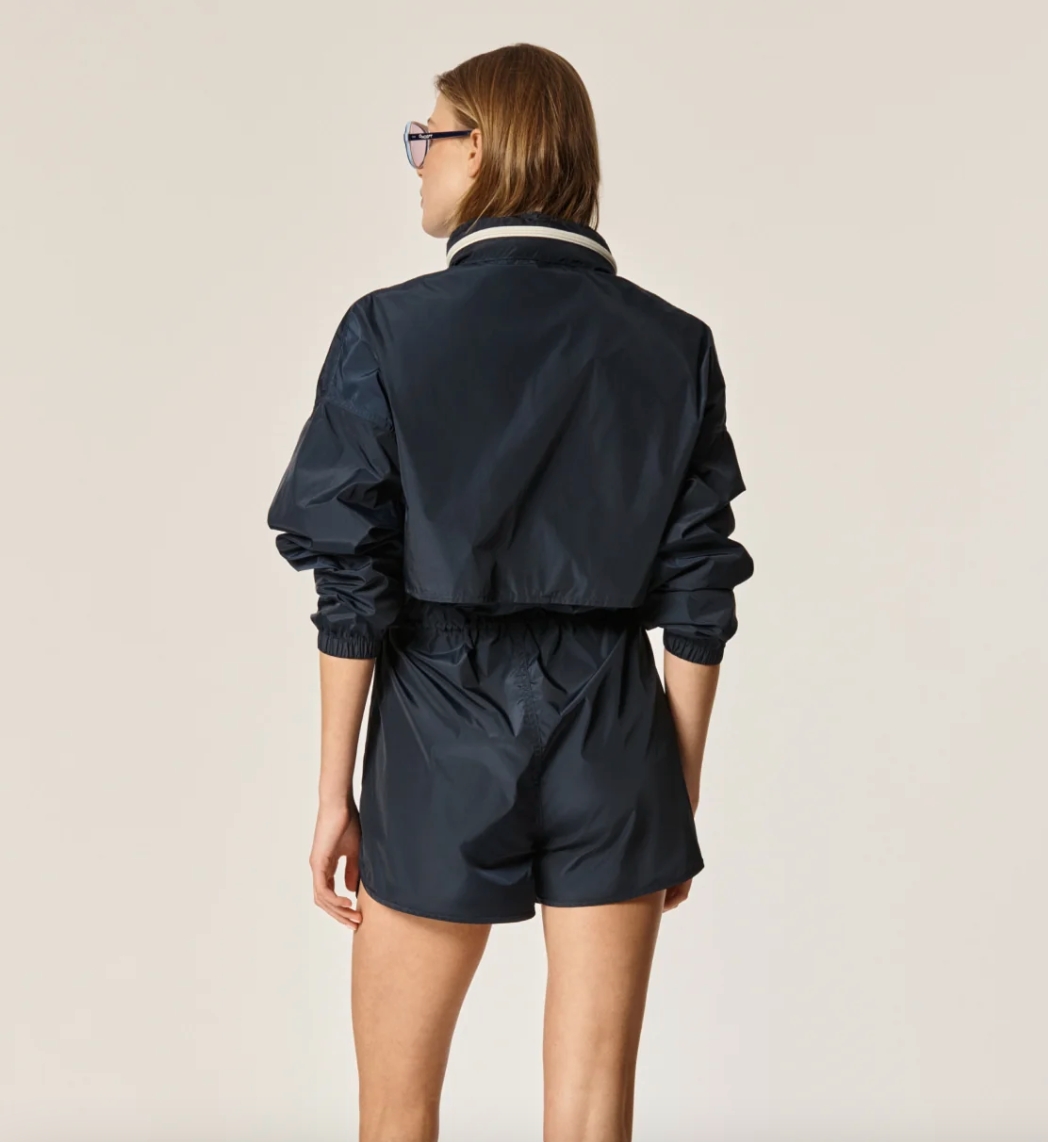 Back view of Oncept's Brooke Utility Romper in the color Indigo
