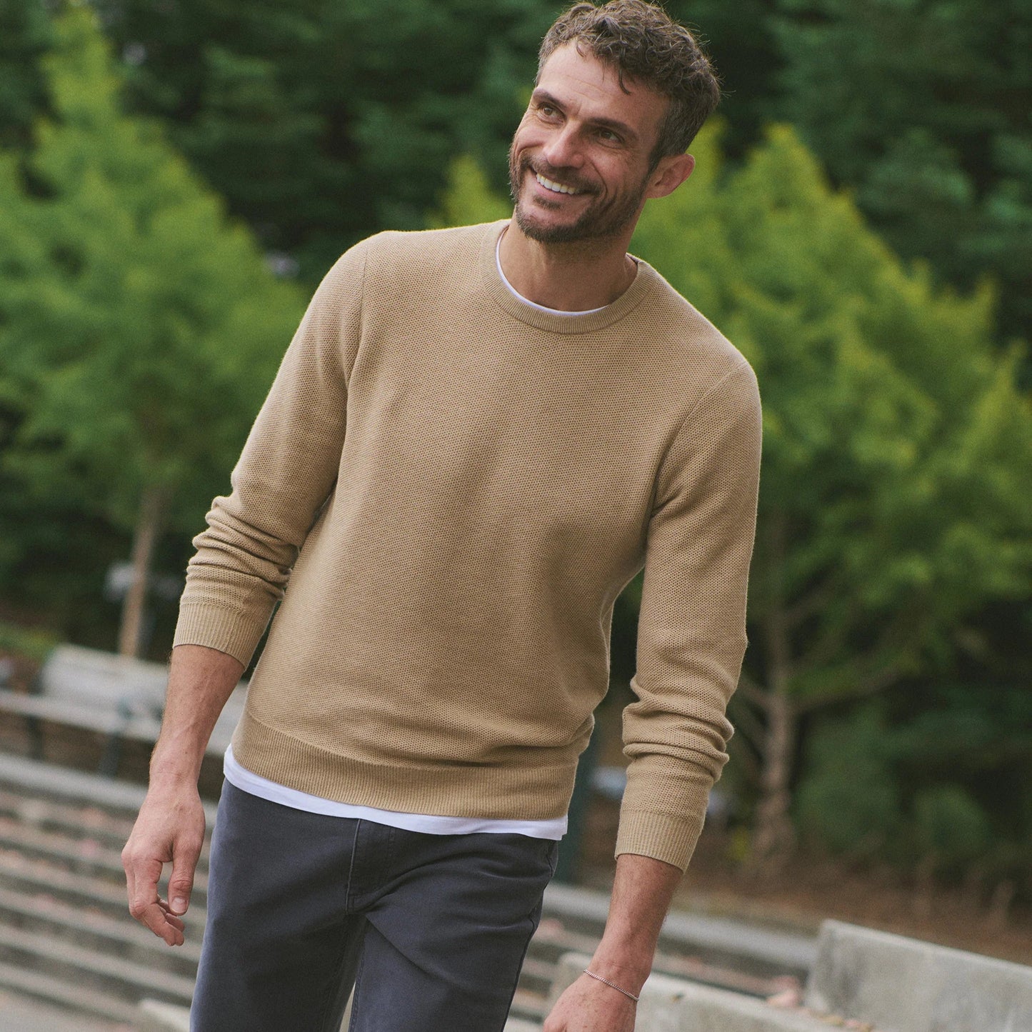 Man wearing a beige sweater tee from Marine Layer