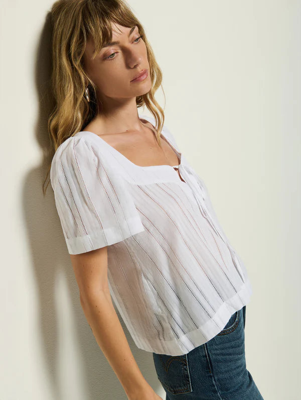 The Vanity Tie Top by Nation is available at Harbour Thread and features bell sleeves with gathered detailing