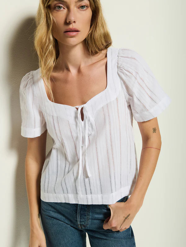 Now at Harbour Thread, the Vanity Tie Top by Nation is crafted from a textured voile cotton and features a sweetheart neckline and keyhole with tie closure.