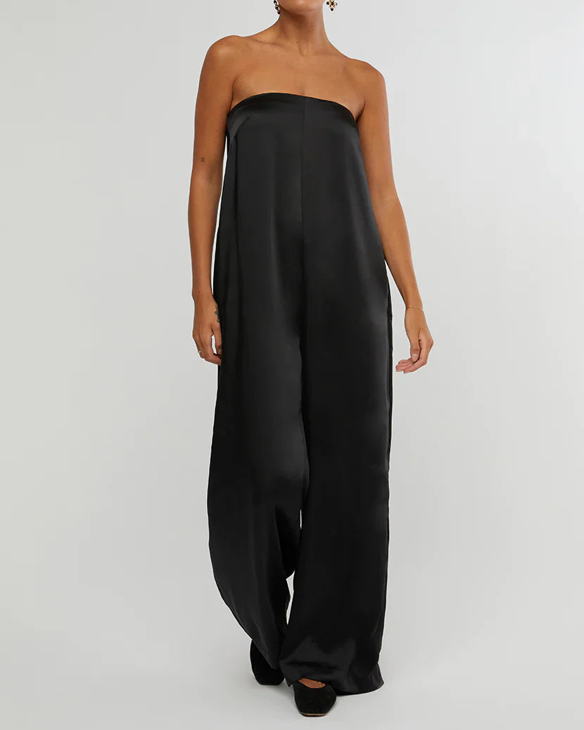 Enjoy chic style with the silky charmeuse Strapless Wide Leg Jumpsuit by WeWoreWhat, on sale now at Harbour Thread boutique in St. Petersburg, FL.