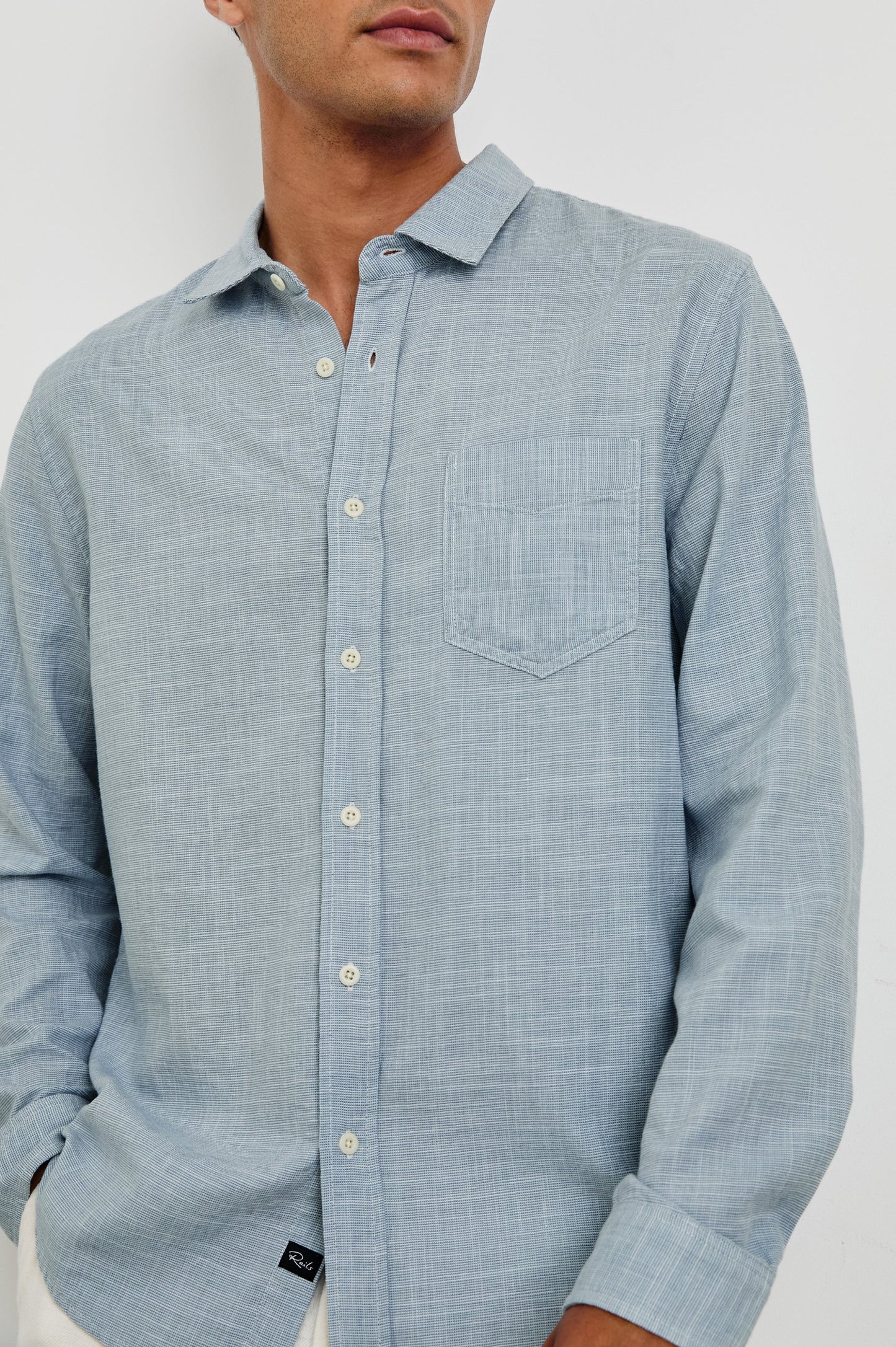 Men's blue cotton button down shirt with patch pocket