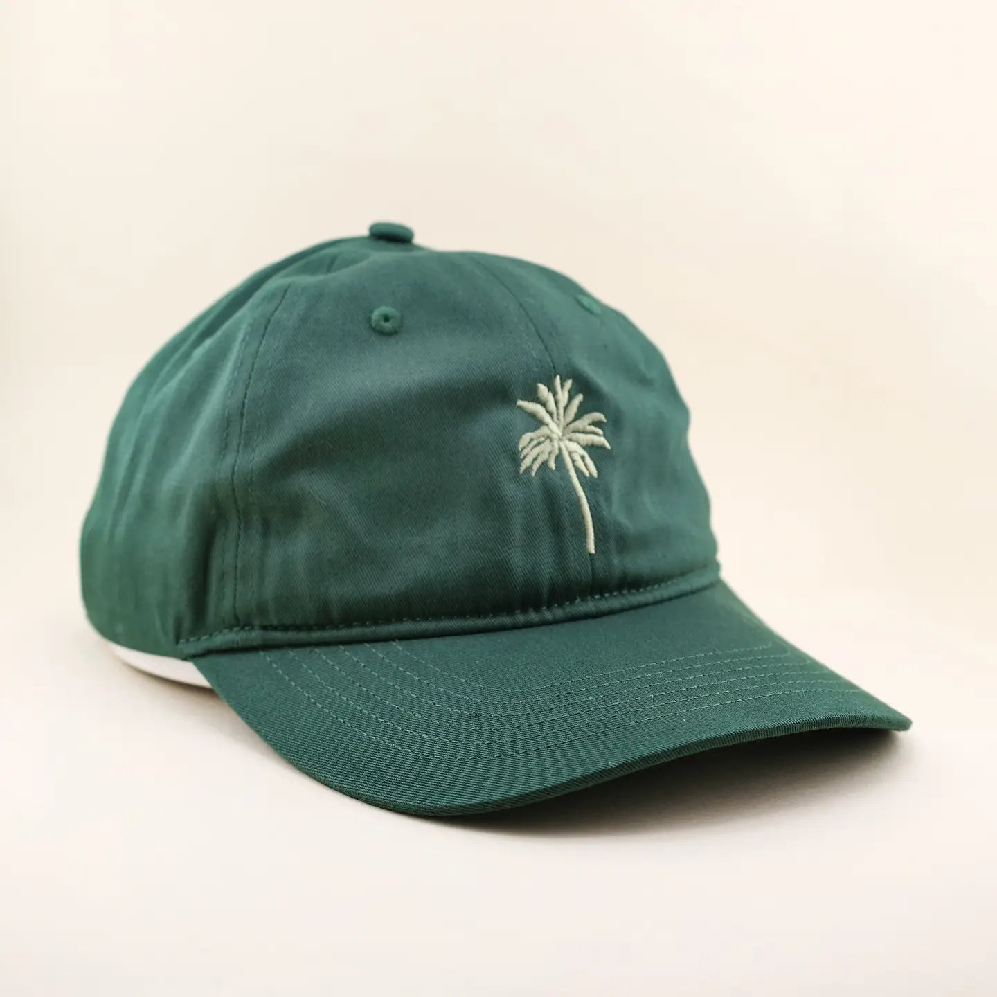 Top off your beach day look with the Freshwater Curated Goods Palm Tree Dad Hat at Harbour Thread women's boutique in St. Petersburg, FL.