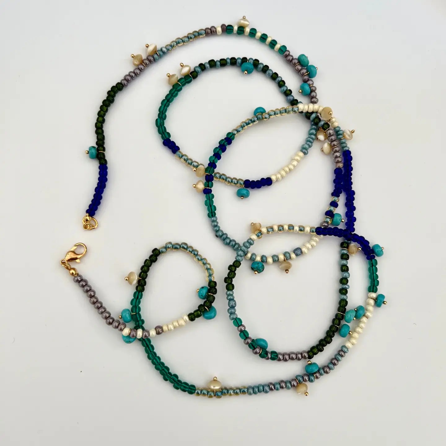 The versatile Kairi Necklace by Sandrine France Studio can be worn as a long single necklace, as a double row necklace or wrapped several times around the wrist. Shop it at Harbour Thread!