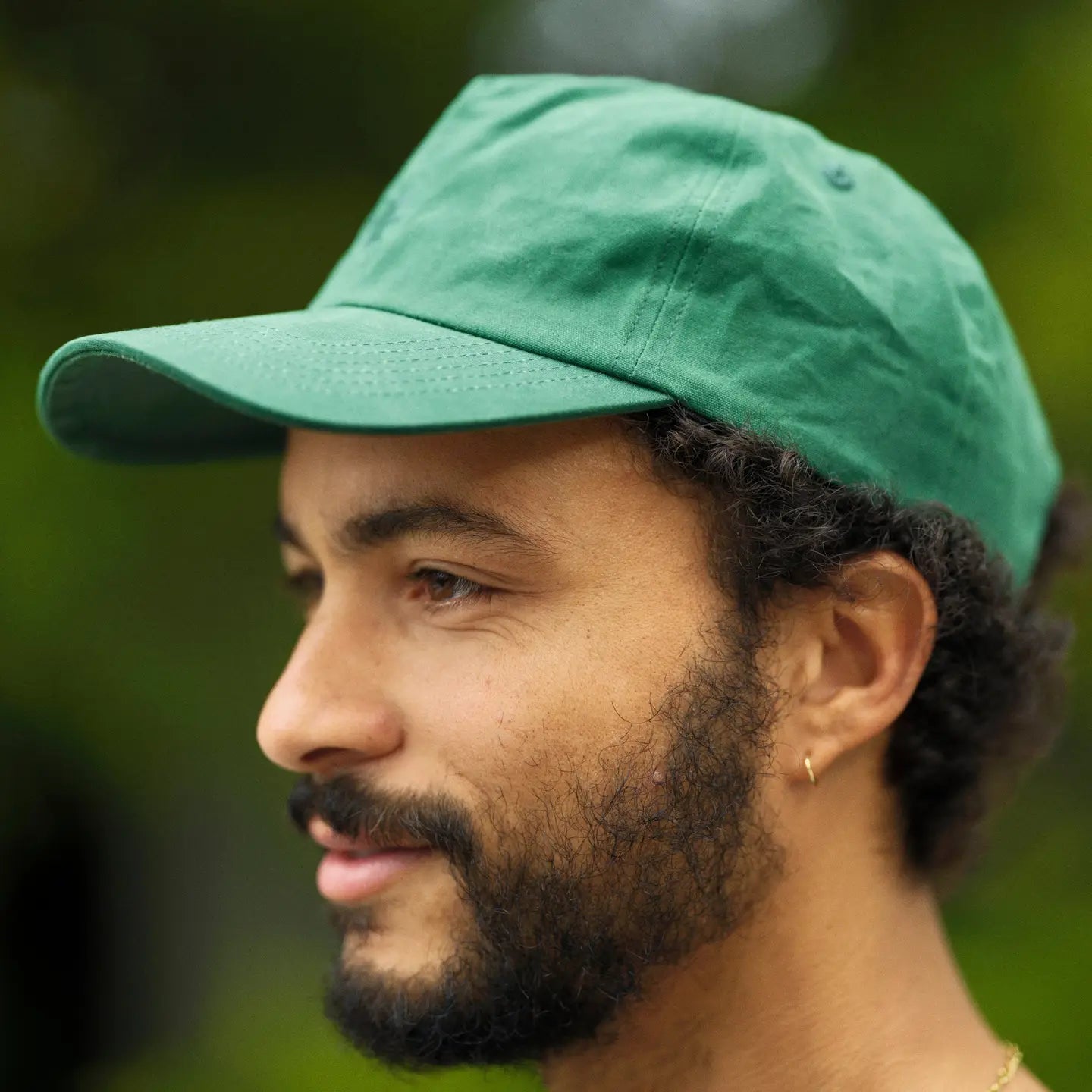 Man wearing a green hat from Mollusk