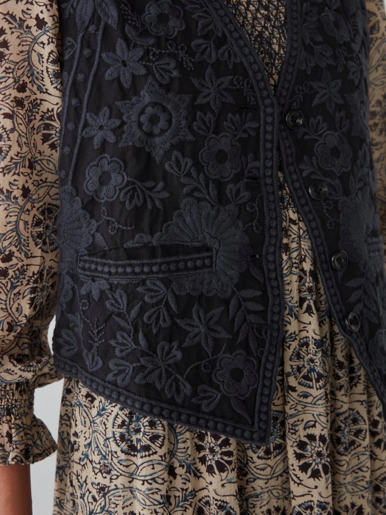 Front pocket and floral embroidery on the Freddie Vest in the color Blue Orchid by the brand Maison Hotel