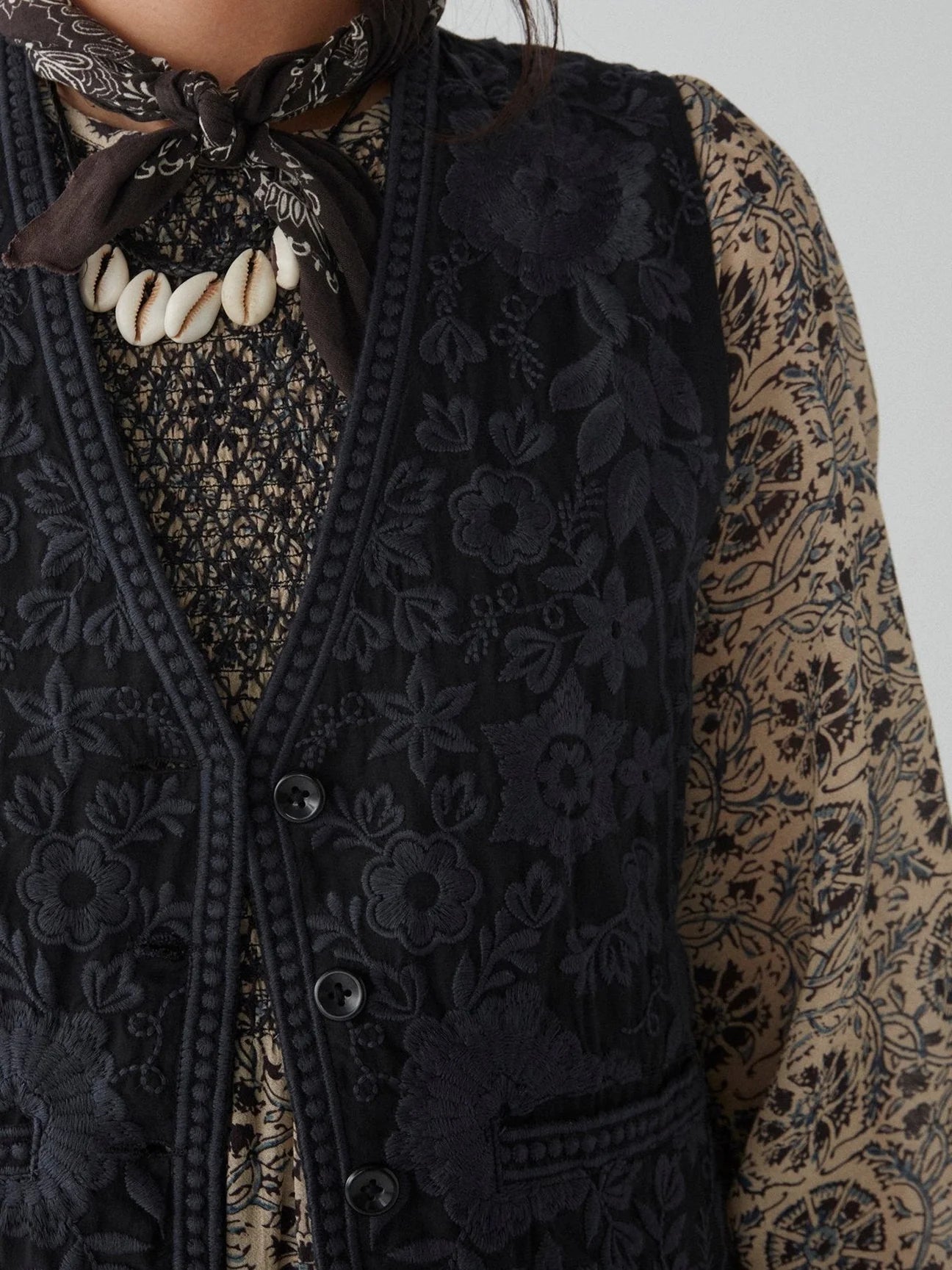 Design detail on the embroidered Freddie Vest in the color Blue Orchid by the brand Maison Hotel