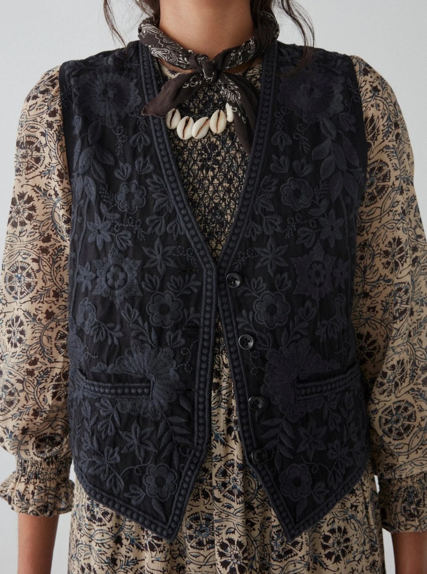 Front view of a woman wearing the embroidered Freddie Vest in the color Blue Orchid by the brand Maison Hotel