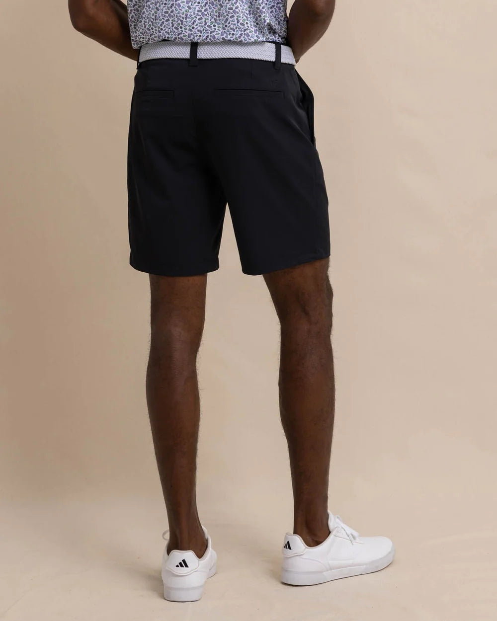 Back view of Southern Tide's brrr°®-die 8" Performance Short in the color Caviar Black