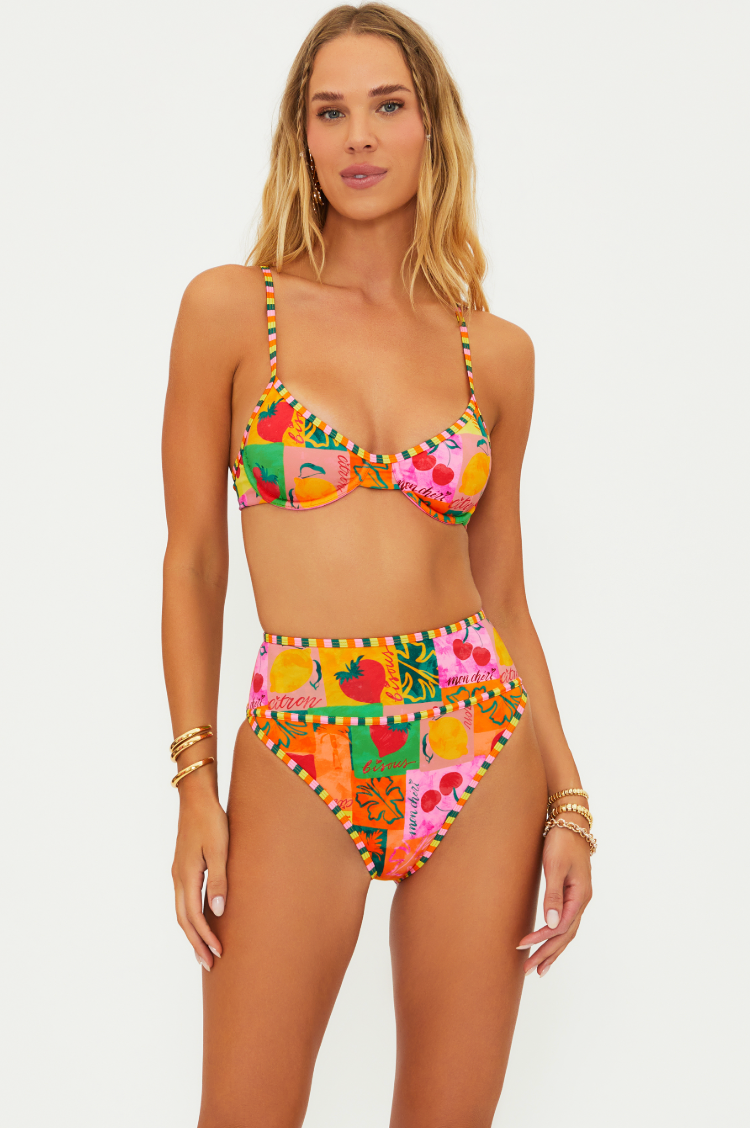 This fun and supportive Breach Riot bikini top at Harbour Thread t is bursting with bold colors and tropical vibes for the summer.