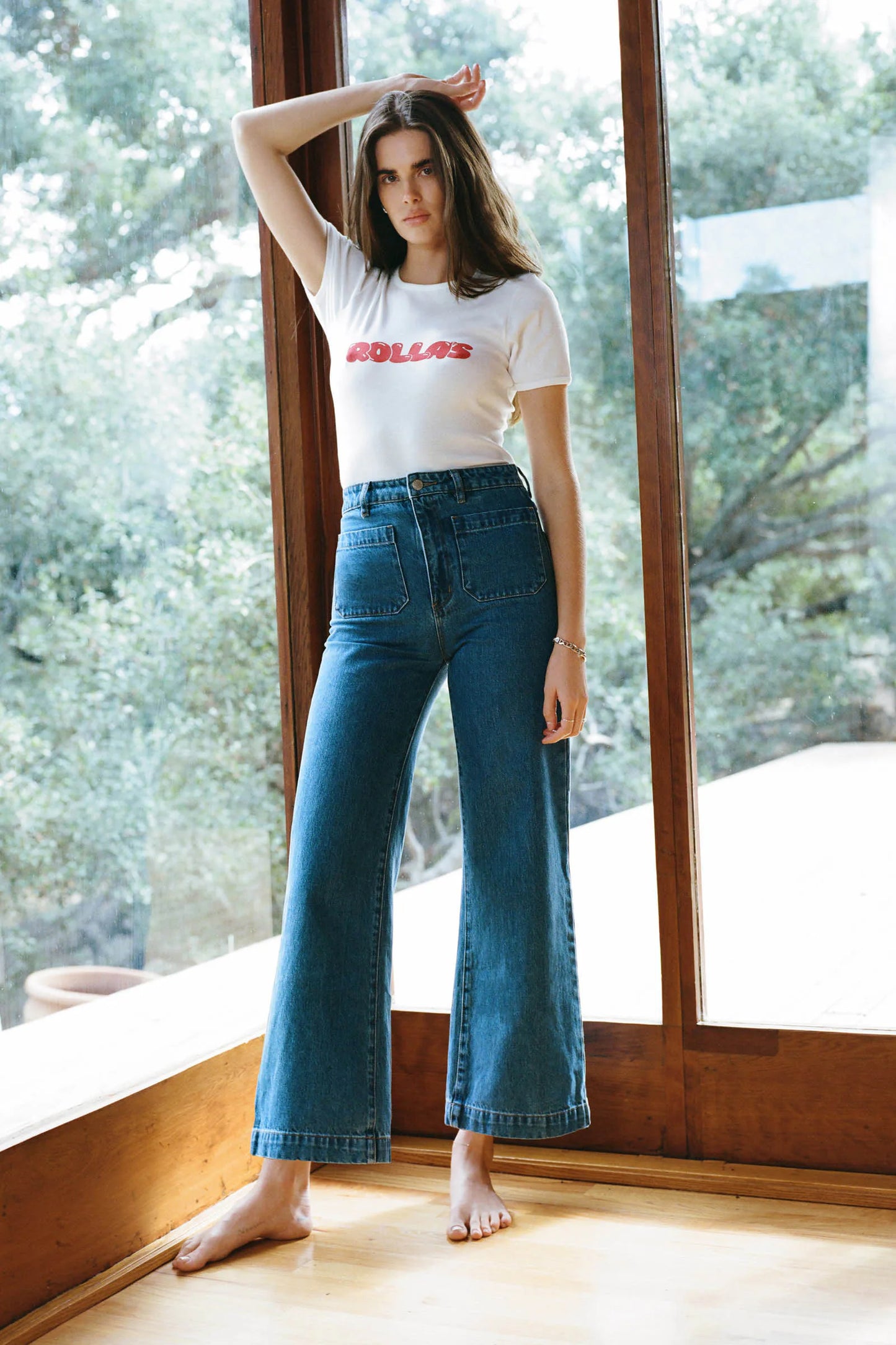 A woman wearing Rolla's Ashley Blue Sailor Jeans