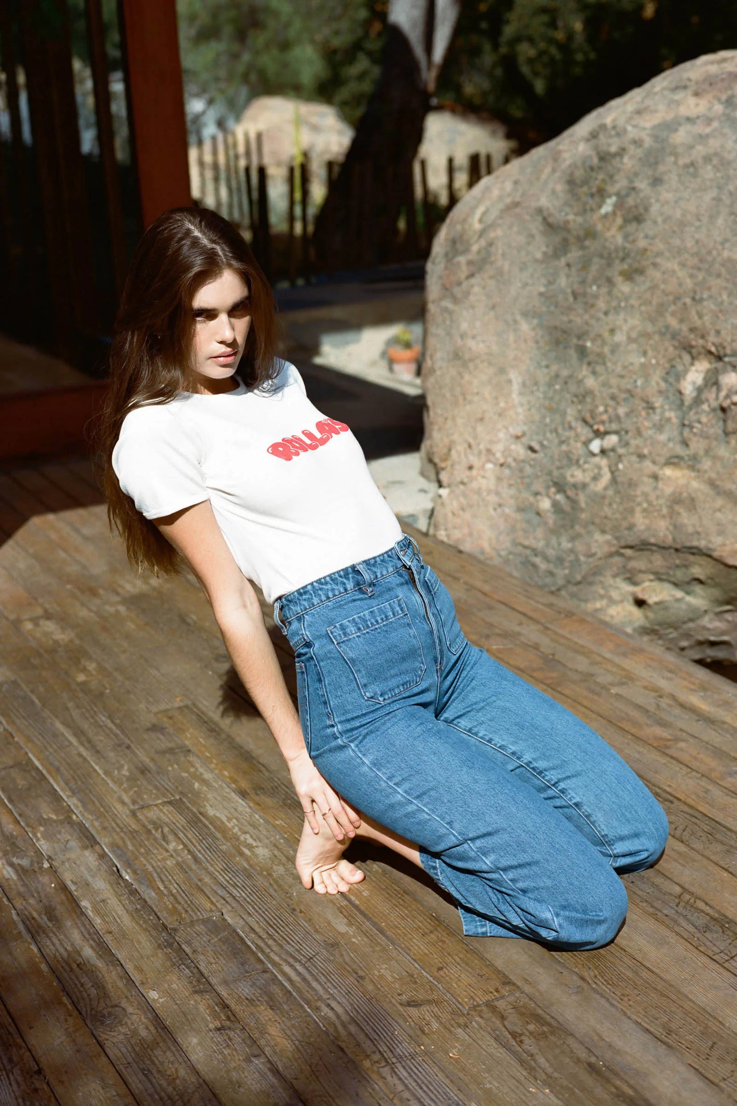 Woman sitting down wearing Rolla's Ashley Blue Sailor Jeans