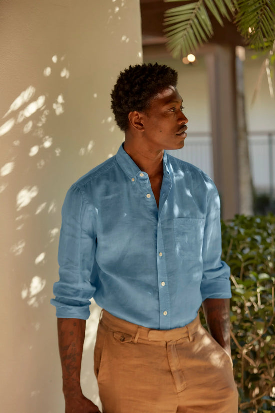 Man wearing Billy Reid's French Blue Tuscumbia Linen Button Down Shirt outside