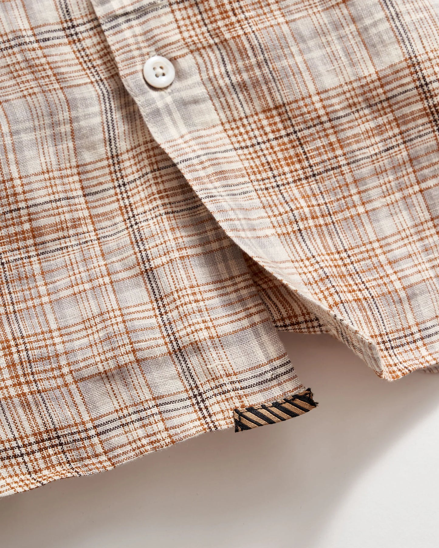 Front button detail view of Billy Reid's Linen Line Plaid Wilson Shirt