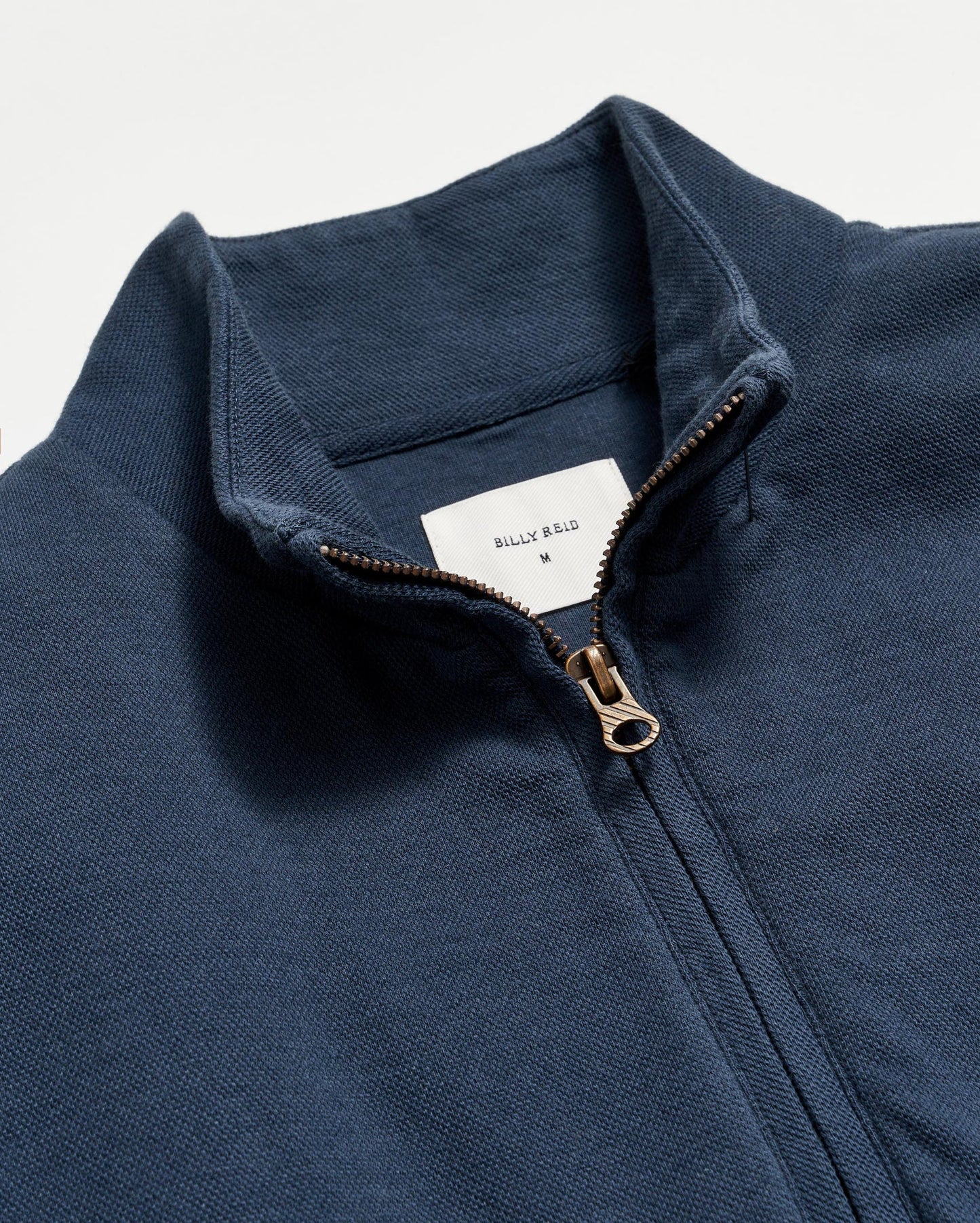 Neckline detail  view of Billy Reid's Cullman Half Zip in the color Navy