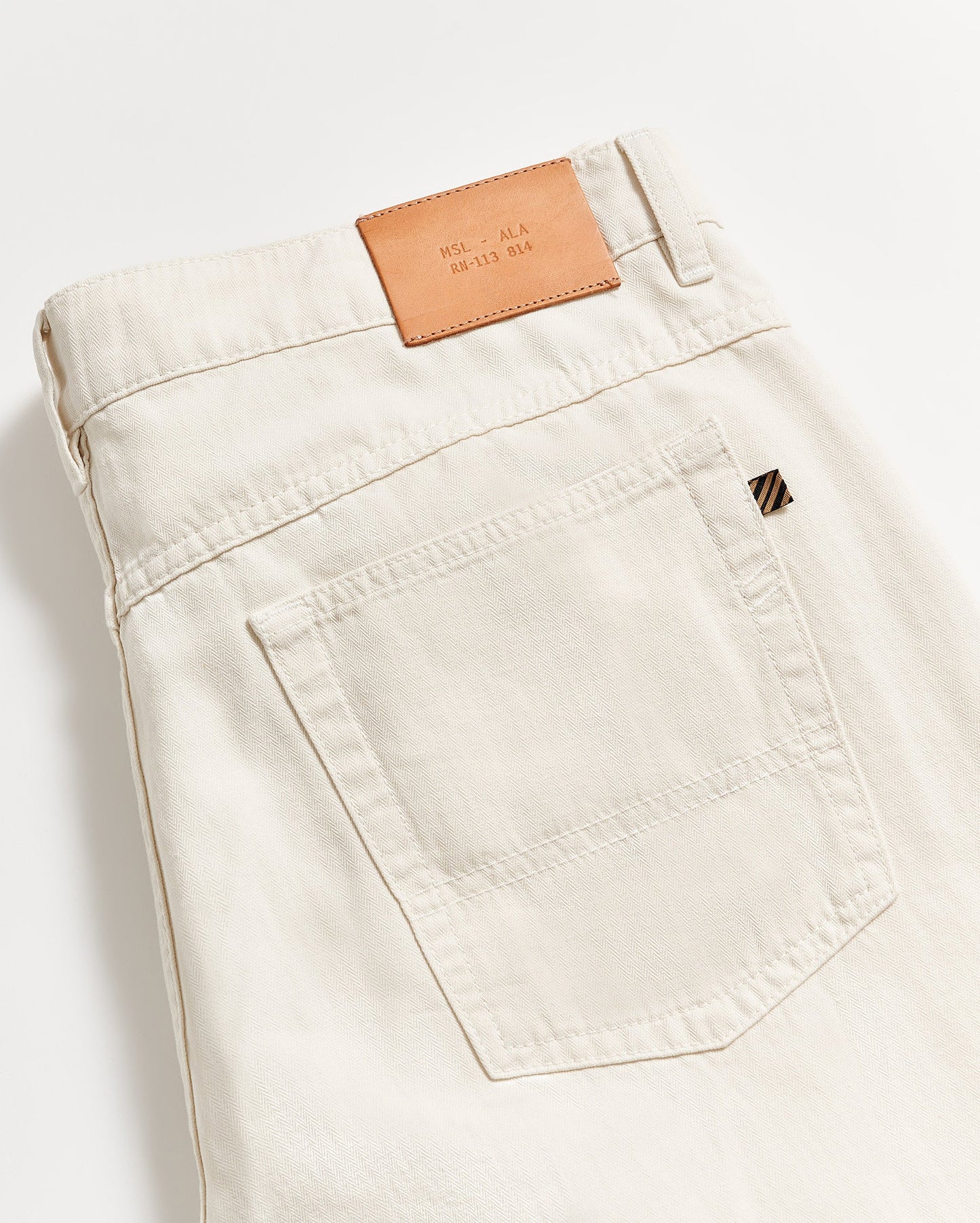 back detail view of the Billy Reid Cotton Linen 5 Pocket Pant in the color Eggshell