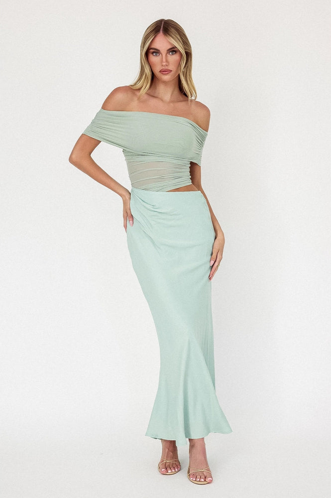 Stun at any event in this glamorous off-shoulder mesh midi dress, available now at Harbour Thread 