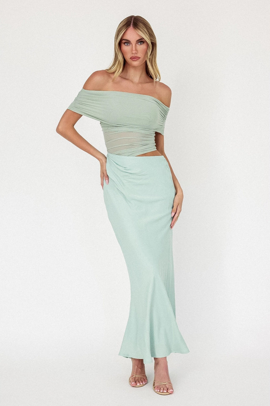 Stun at any event in this glamorous off-shoulder mesh midi dress, available now at Harbour Thread 